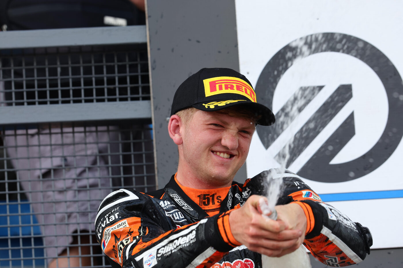 Calum Beach celebrating a podium finish