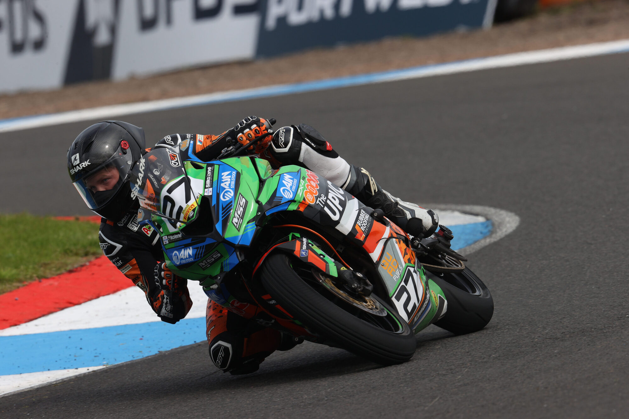 Calum Beach leaned hard into a corner on the number 27 Triumph Daytona 660